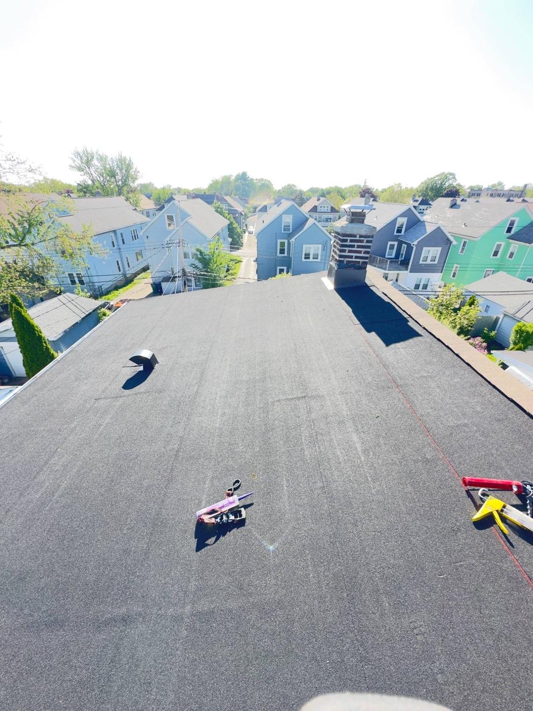New flat roof with chimney flashing