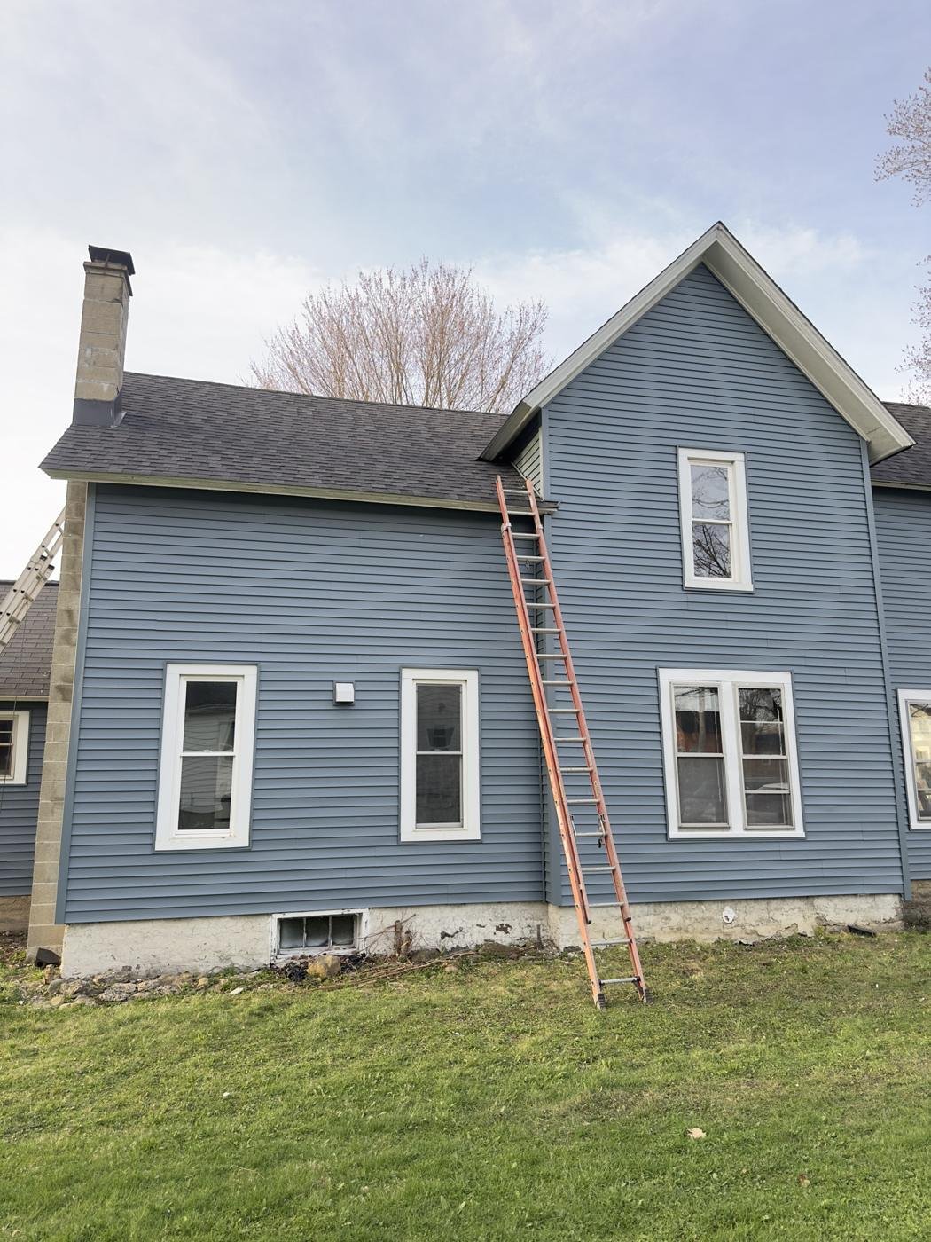 Home with new blue siding